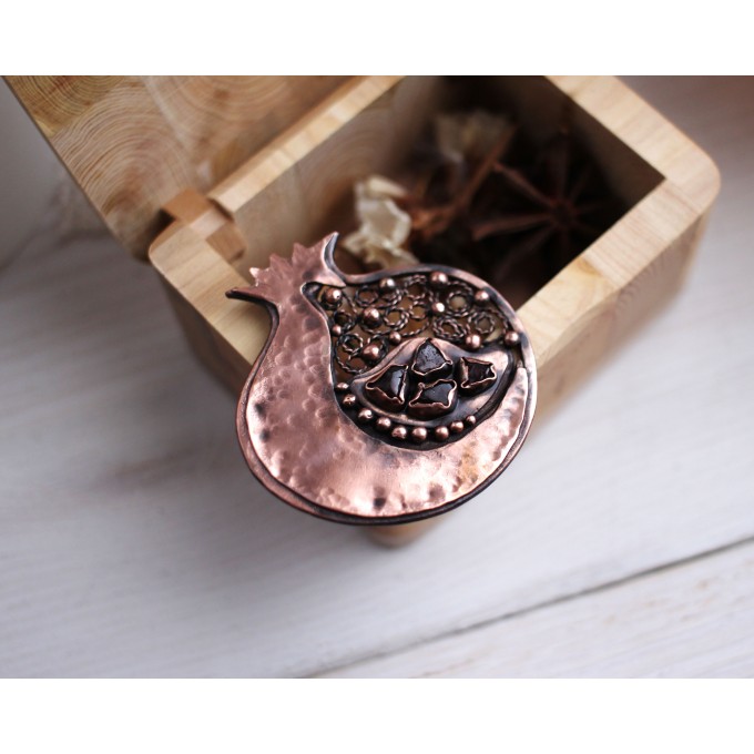 Copper filigree pomegranate brooch with garnet
