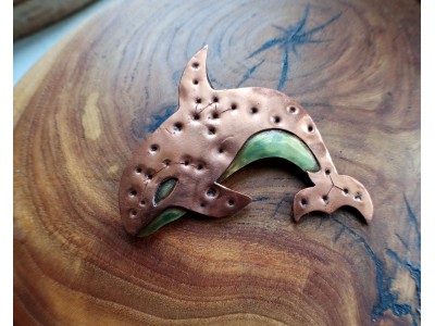 Copper killer whale brooch